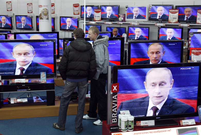 Во время пресс-конференции Владимира Путина. Фото: Denis Sinyakov / Reuters