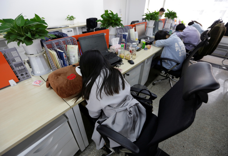 Офисные работники, Пекин. Фото: Jason Lee / Reuters