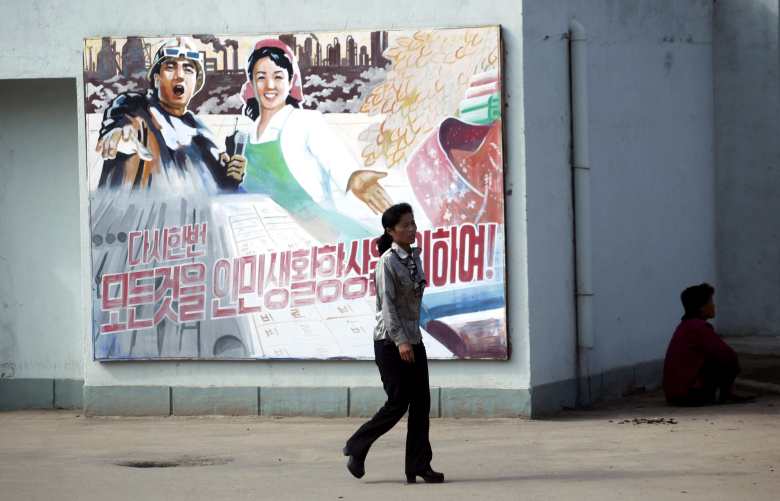 Плакат в специальной экономической зоне города Расон, Северная Корея. Фото: Carlos Barria / Reuters