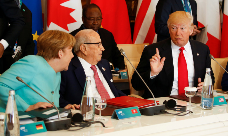 Ангела Меркель, Беджи Каид Эс-Себси и Дональд Трамп на саммите G7. Фото: Jonathan Ernst / Reuters