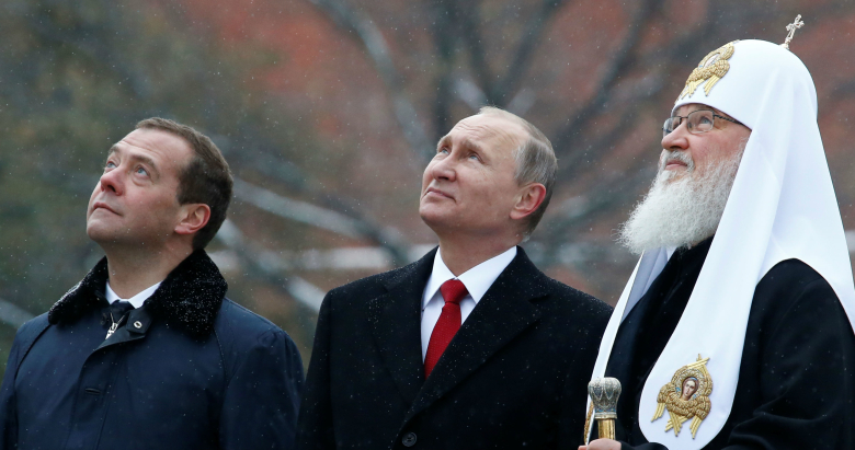 Дмитрий МЕдведев, Владимир Путин и патриарх Кирилл. Фото: Sergei Karpukhin / Reuters