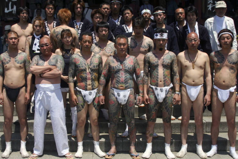 Члены якудза на фестивале Сандзя в Токио, Япония. Фото: Jiangang Wang / Getty Images